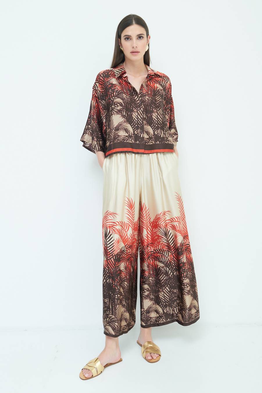 Kikisix PANTALONE PALAZZO FANTASIA BALZA MORO/ARANCIO Bestseller