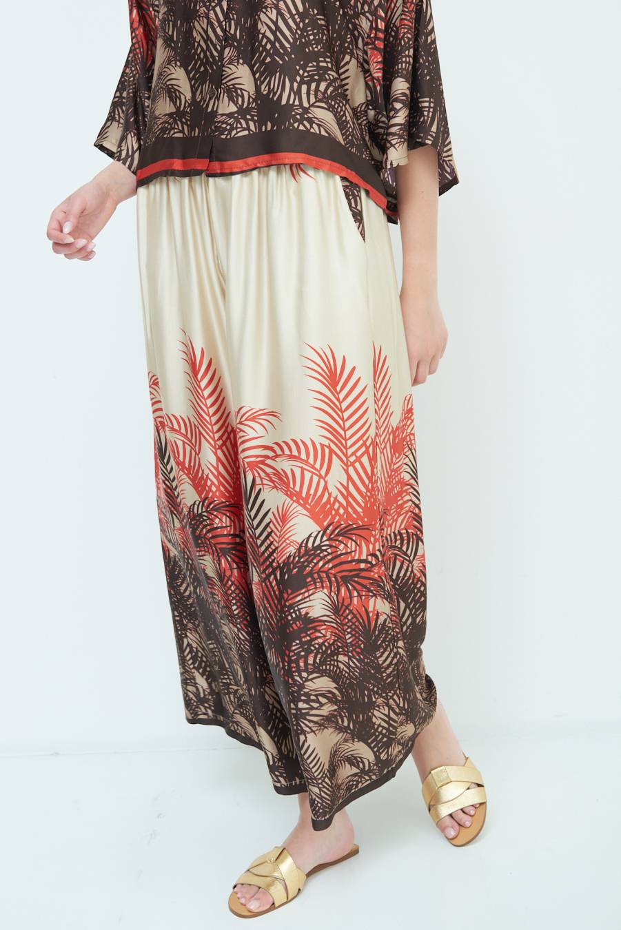 Kikisix PANTALONE PALAZZO FANTASIA BALZA MORO/ARANCIO Bestseller
